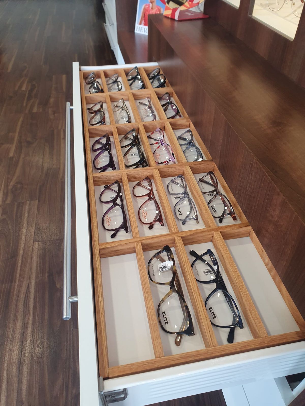 Bespoke oak-divided display drawer built for a Coventry opticians