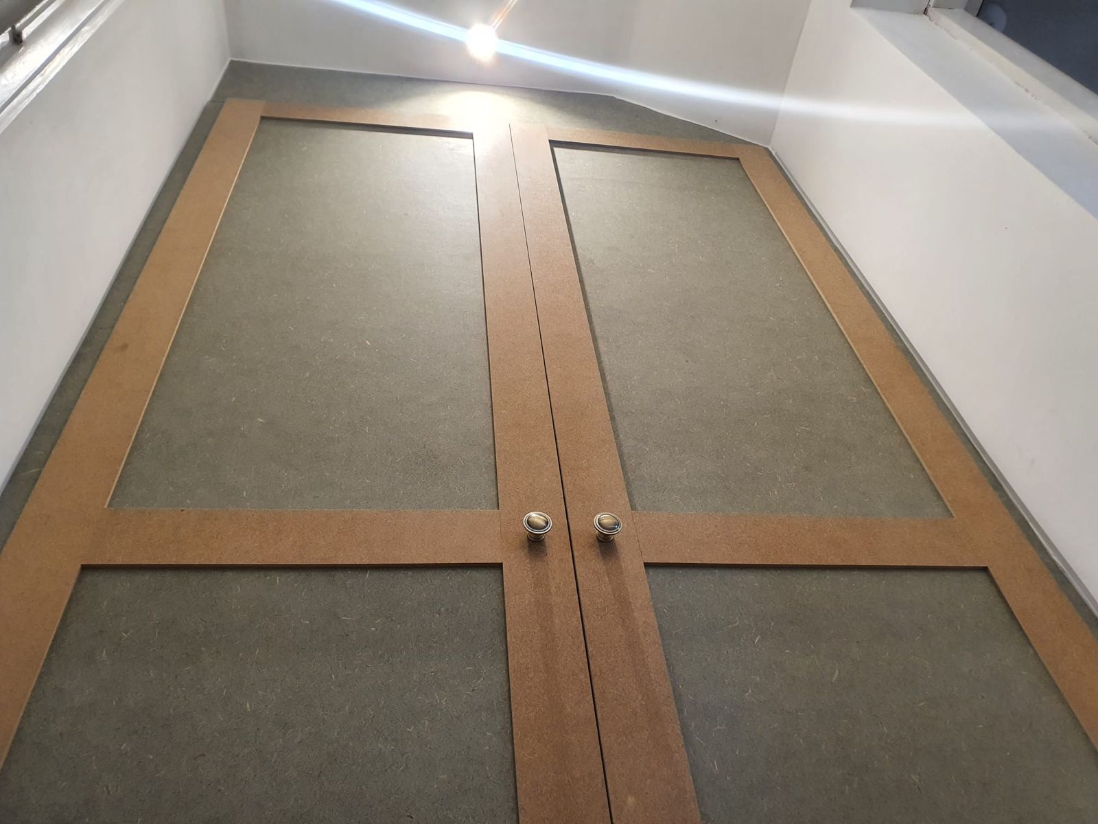 Shaker-style fitted wardrobe doors built in MDF, ready for painting